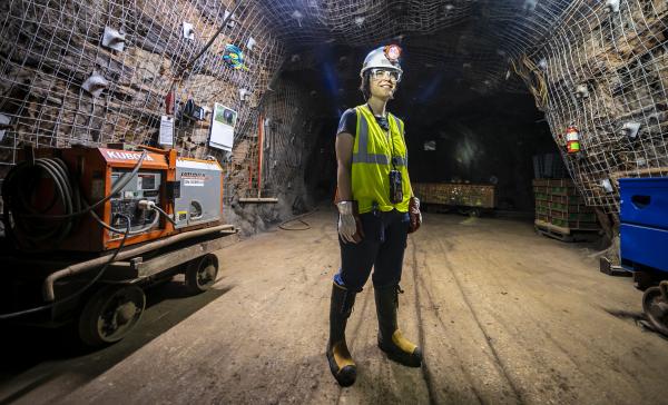 "Gina Gibson at SURF – Gina Gibson is an internationally exhibiting artist and professor of Graphic Design at Black Hills State University. In 2019, Gibson became the first artist in residence at the Sanford Underground Research Facility. Photo courtesy of the Sanford Underground Research Facility/Photographer Matt Kapust"