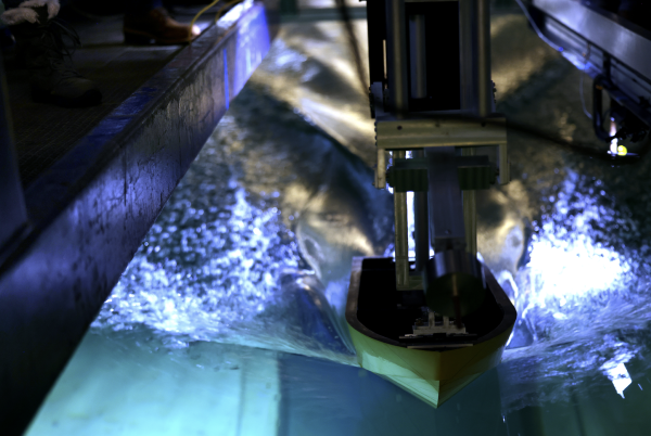 Hydrodynamic Experiment of a Model Planing Hull in the MHL Towing Tank