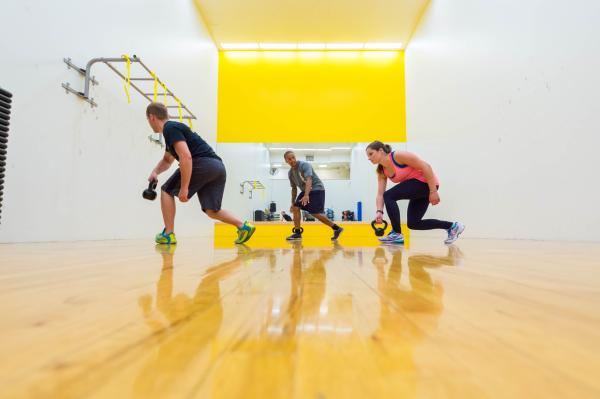 person leading a kettlebell class