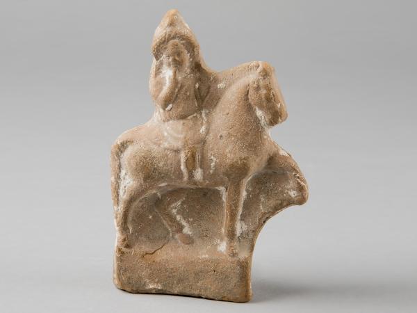 Stone figurine of Hellenistic god Harpocrates riding a horse.