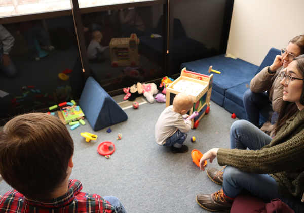 Family playing in CEW+ caregiver space