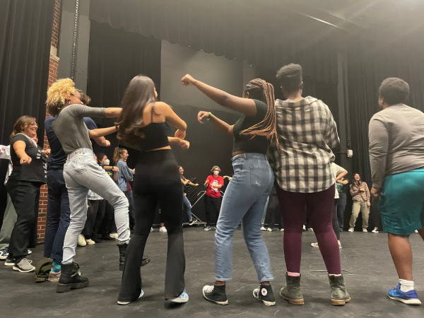 Students playing theatre games in course workshop
