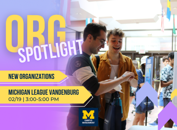 two students conversing at a student org fair