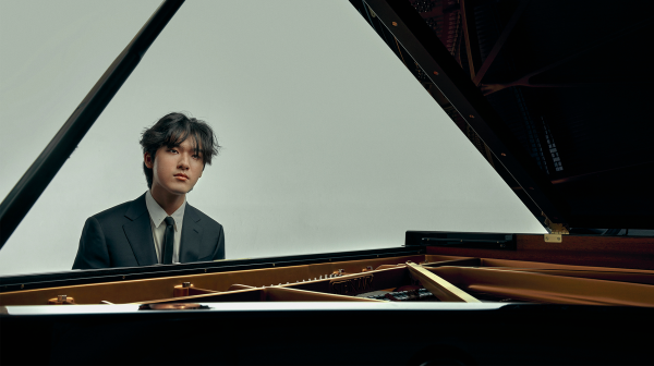 Yunchan Lim sits at a piano.