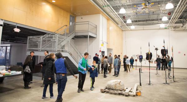 People view an exhibition of MFA work at the faculty and graduate studios.