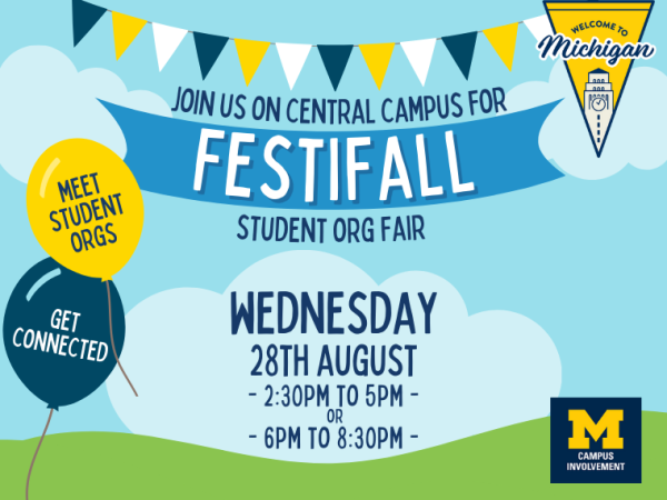 festifall central event with balloons and a banner