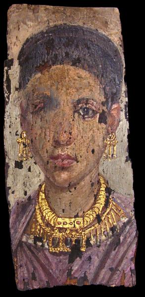 A chipped, painted mummy portrait of a woman wearing gold jewelry.
