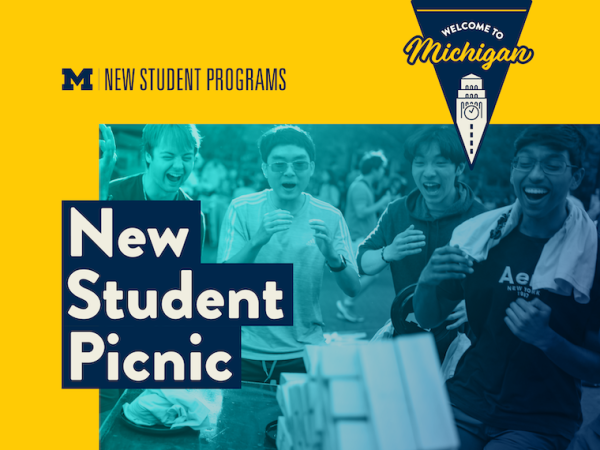 Students smiling and playing games at a picnic