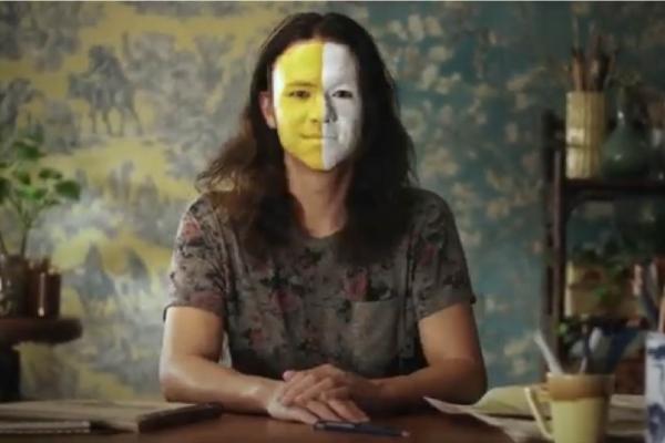 Shal Ngo in a still frame from the short film Hapa - with half of his face yellow and half white.