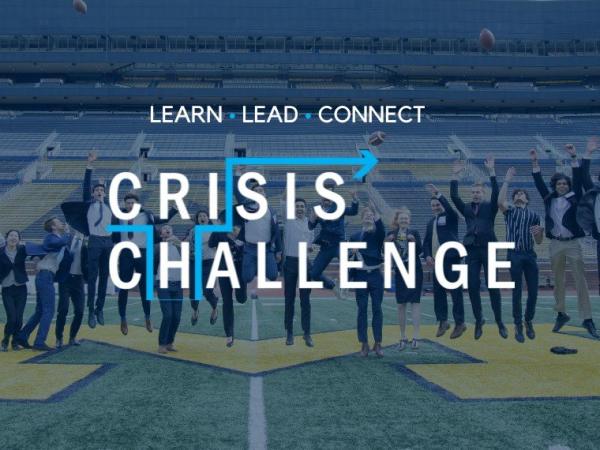 Students celebrating on the Big House field for the Crisis Challenge