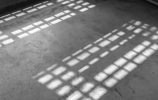 Light coming from the windows in an old building.