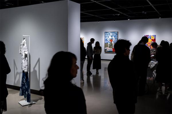 Stamps Gallery visitors view work at the 2024 Undergraduate Juried Exhibition.