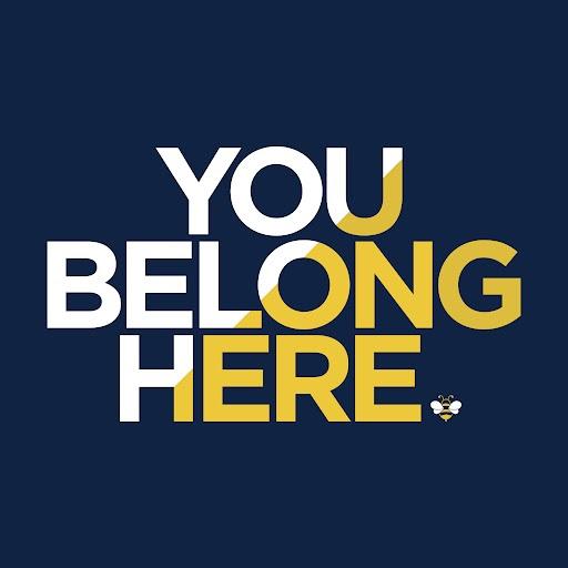 Image with the words stating ‘You Belong Here’ with yellow, blue, and white colors