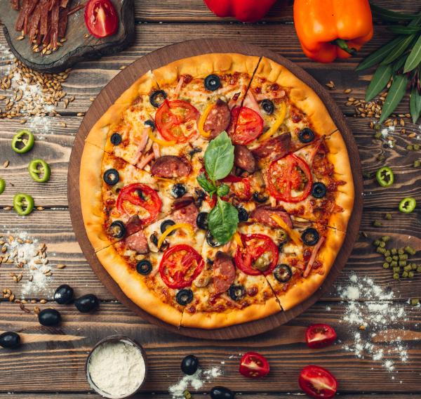 Pizza with salami, tomatoes and olives