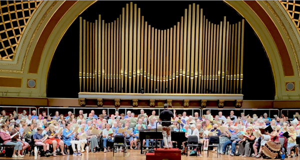 Participants on stage at Hill Auditorium for a previous Summer Sings.