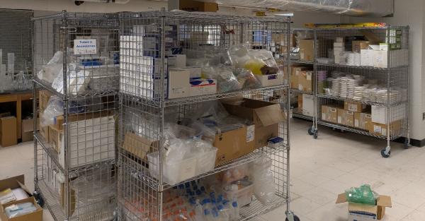 Wire racks with lab supplies on them