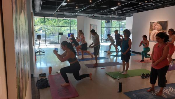 Guests take part in a Pilates workshop at Stamps Gallery