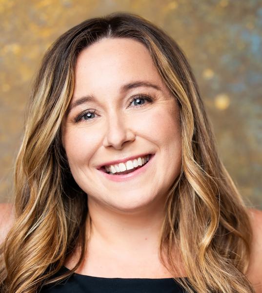 Headshot of Katina Sawyer from the shoulders up smiling.