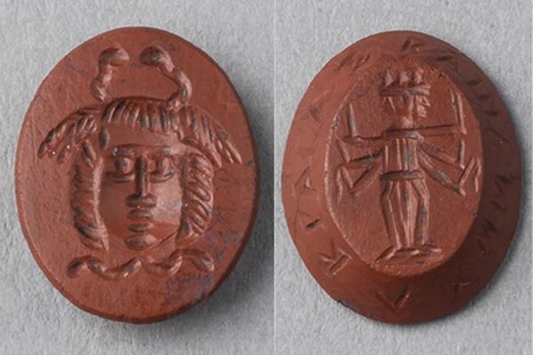 Red jasper evil-averting amulet, Roman period, date unknown, depicting a Gorgon head with snakes, and a Hecate trimorph wielding weapons.