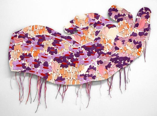 A fabric hand, embroidered with a pattern of lavender, purple, and orange flowers