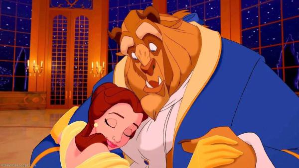 The Beast, surprised, holds Belle in this still from the Disney animated adaptation of Beauty and the Beast.