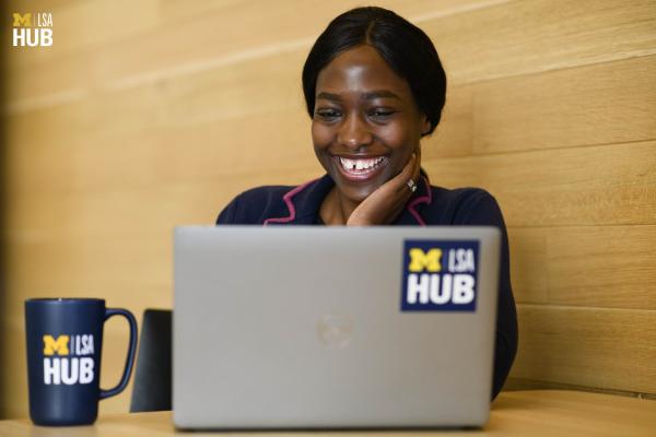 An LSA student working on their resume on a laptop.