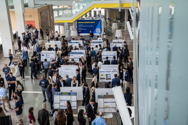 Overhead photo of people presenting poster research