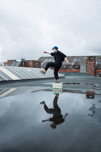 Man dancing on a rooftop