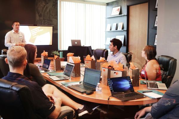 Conference room filled with people watching a presentation