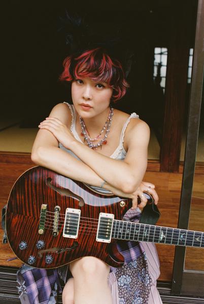 Woman holding guitar