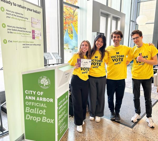 Students at the Campus Voting Hub wearing Victors Vote Early t-shirts