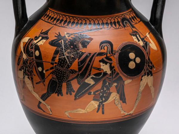 Black-figure two-handled amphora depicting Herakles, wearing his lion-skin cloak, battling three Amazons armed with shields and spears.