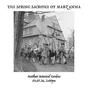 A black and white image of a folk procession in Europe. Children dressed in traditional costume carry sheaves of wheat, bows, and an effigy of Marzanna.