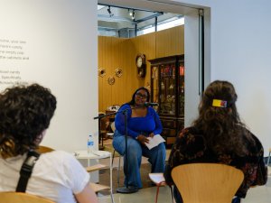 Michaela Nichelle (MFA '26) leads a reading and discussion event at Stamps Gallery.