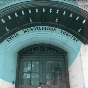Wooden double doors beneath an arched sign reading "Lydia Mendelssohn Theatre" at the University of Michigan, highlighted in a teal overlay.