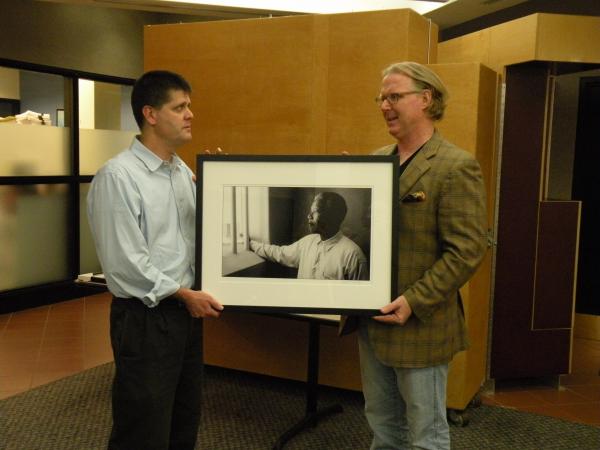 Ken Kollman, Director of the U-M International Institute, accepts a photo from D