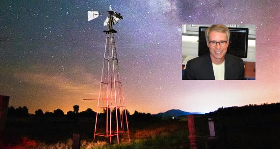 Image of a starry sky with a windmill in the foreground. Inset: Stacy McGaugh of
