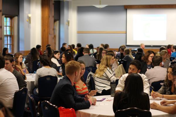 Photo of students attending an informal networking chat with alumni and recruiters