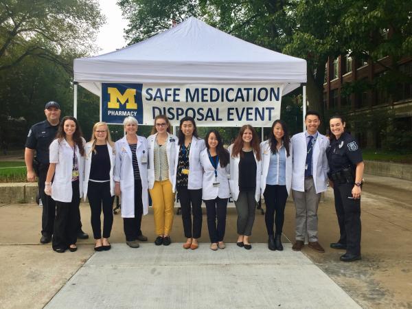 Pharmacy students collecting medication