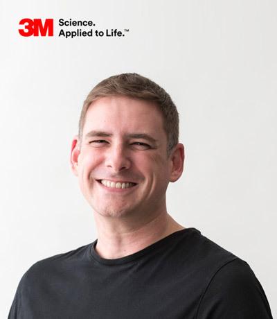 Portrait photo of a smiling man in black t-shirt