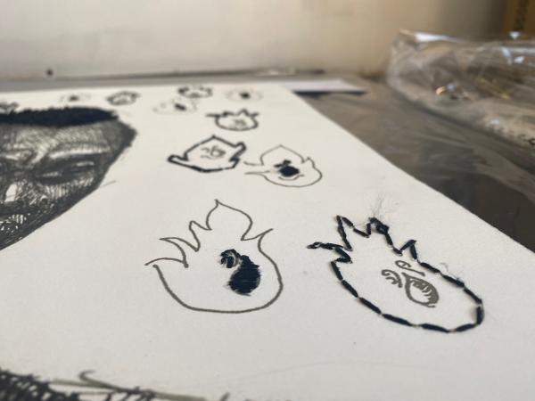 Image of ink drawings and embroideries on paper