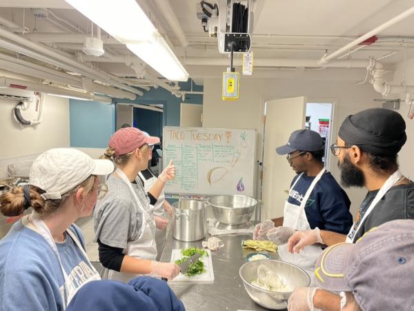 Students cooking a meal together.