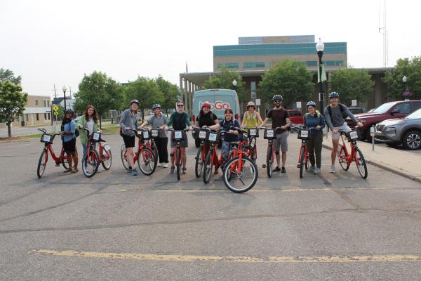 Students tour a city's sustainability initiatives on bicycle