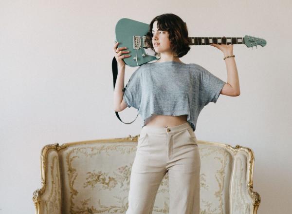 Ani Mari poses with a guitar