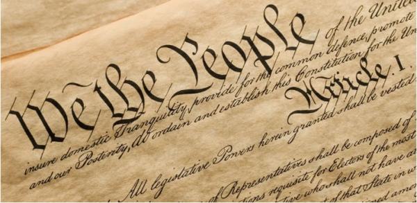 Up close image of the U.S. constitution "We the People" text